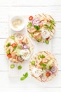 Spicy tacos with grilled salmon, vegetables, ricotta cheese, chili and fresh mint Royalty Free Stock Photo