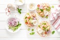 Spicy tacos with grilled salmon, vegetables, ricotta cheese, chili and fresh mint Royalty Free Stock Photo
