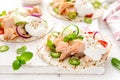 Spicy tacos with grilled salmon, vegetables, ricotta cheese, chili and fresh mint Royalty Free Stock Photo