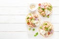 Spicy tacos with grilled salmon, vegetables, ricotta cheese, chili and fresh mint Royalty Free Stock Photo