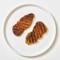 spicy tenderized beef cutlets on white background Royalty Free Stock Photo