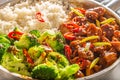 Spicy teriyaki chicken with steamed broccoli and rice in a pot Royalty Free Stock Photo