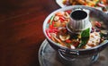 Spicy thai food soup sercve with hot iron pot