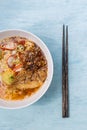 Spicy Thai style egg noodle soup with roasted pork Royalty Free Stock Photo