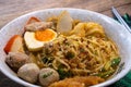 Spicy tom yam noodle soup with boiled egg and grilled red pork. Royalty Free Stock Photo