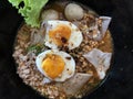 Spicy tom yam noodle soup with boiled egg, pork and big Royalty Free Stock Photo