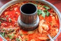 Spicy tom yum goong Thai style in the hot pot, spicy soup, a classic spicy lemongrass and shrimp soup recipe from Thailand Royalty Free Stock Photo