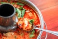 spicy tom yum goong Thai style in the hot pot, spicy soup, a classic spicy lemongrass and shrimp soup recipe from Thailand