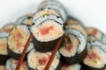 Spicy Tuna Roll being selected with Chopsticks Royalty Free Stock Photo