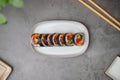 spicy tuna sushi roll. with avocado and cucumber. Top view . Flatlay. Japanese traditional food and cooking concept Royalty Free Stock Photo