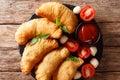 Spicy typical street Italian food: fried panzerotti with tomato Royalty Free Stock Photo
