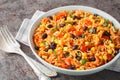 Spicy vegetarian side dish tomato rice with black beans, onions and corn close-up in a bowl. Horizontal Royalty Free Stock Photo