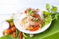 Spicy Vermicelli Seafood Salad with vegetable ingredient on wood white background, Thai food Street food Concept.Top View Royalty Free Stock Photo
