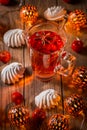 Spicy winter tea or punch with anise and meringue pastry Royalty Free Stock Photo