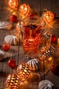 Spicy winter tea or punch with anise and meringue pastry Royalty Free Stock Photo