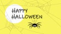 Spider hanging on happy halloween letters