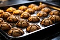 spider-shaped cookies on a baking sheet straight from the oven Royalty Free Stock Photo