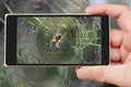 Spider on smartphone screen. Little spider on web.