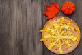 Spider web pancakes with sugar syrup and powder for Halloween breakfast. With crochet orange pumpkin and leaf Royalty Free Stock Photo