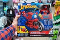 Spiderman toy with power bike in a toy store. Buyer Choosing Spider-Man Figure. Minsk, Belarus, 2022 Royalty Free Stock Photo