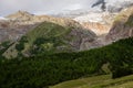 Spielboden and LÃÂ¤ngfluh cablecar stations in front of the melting Fee Glacier Feegletscher and moraine at sunrise Royalty Free Stock Photo