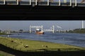 container ship crossing the the new botlek bridge near rotterdam