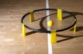 Spike ball game with yellow ball on hardwood court floor. Horizontal sport theme poster, greeting cards, headers, website and app Royalty Free Stock Photo