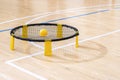 Spike ball game with yellow ball on hardwood court floor. Horizontal sport theme poster, greeting cards, headers, website and app Royalty Free Stock Photo