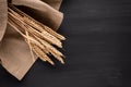 Spikelet of wheat lying on the table in a dark color. Ripe and Golden Wheat