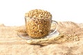 Spikelets of wheat with whole grains on the burlap