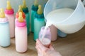 Spill milk into bottles with colored lids and nipples