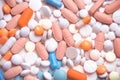 Spilled blue white pink orange pills Royalty Free Stock Photo