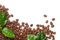 Spilled Coffee Beans With Green Leaves Isolated Royalty Free Stock Photo