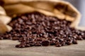 Spilled coffee beans on wooden Royalty Free Stock Photo