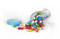 Spilled container of colorful pills. Royalty Free Stock Photo