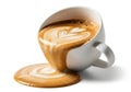 A spilled cup of latte art coffee creating a puddle on a white background isolated on white background Royalty Free Stock Photo