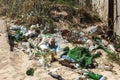 Spilled garbage on beach of big city. Empty used dirty plastic bottles. Dirty sea sandy shore Black Sea. Environmental pollution. Royalty Free Stock Photo