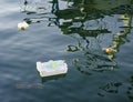 Spilled garbage on the beach of the big city.