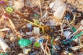 Spilled garbage on the beach. Empty used dirty plastic bottles. Dirty sea, sandy coast the Black Sea. Environmental pollution.
