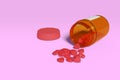 Spilled hearts pills next to a pill bottle isolated on a pink background. Concept of addiction to social media. Royalty Free Stock Photo