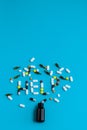 Spilled pills on a blue background. Help sign Royalty Free Stock Photo