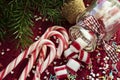 Christmas sweet candies spilled/poured from glass