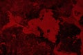 Spilled red paint on a thinner solution forming an abstract pattern. Royalty Free Stock Photo