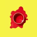 Spilled red puddle of paint with can on an yellow background. Royalty Free Stock Photo