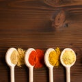Spilled spices on wooden table - Top view Royalty Free Stock Photo