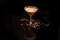 Spilled on the table and running down the glass Espresso Martini cocktail in a martini glass decorated with coffee beans Royalty Free Stock Photo