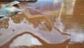 spilled water which can be a mirror because it reflects the image Royalty Free Stock Photo