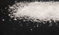 Spilled white sea salt  black background Royalty Free Stock Photo