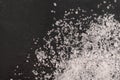 Spilled white sea salt  black background Royalty Free Stock Photo