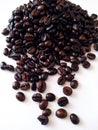 Coffee beans spilling in a while background Royalty Free Stock Photo